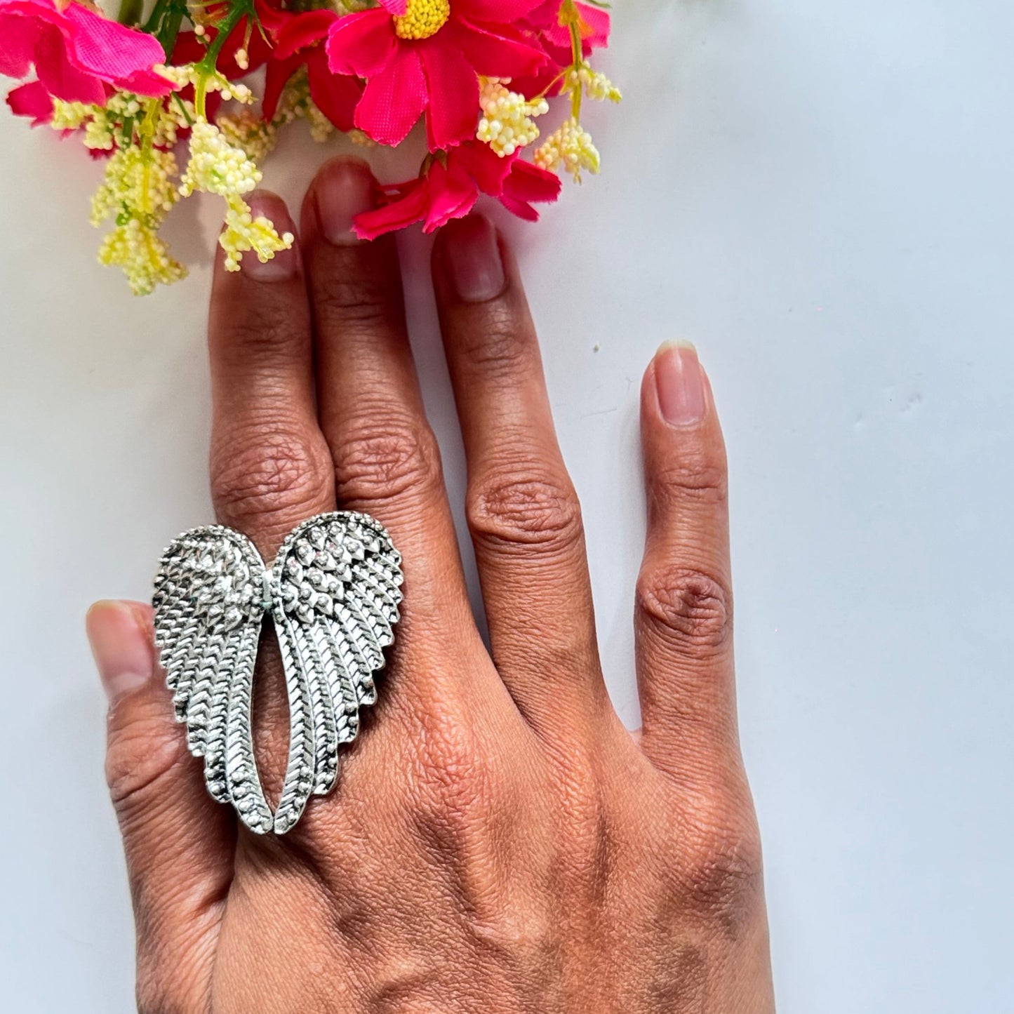 Unleash your inner angel with this breathtaking silver wing statement ring, a true masterpiece of elegance and symbolism. Featuring intricately detailed feathers with a radiant metallic finish, this bold accessory embodies strength, freedom, and divine beauty. The dramatic open-wing design gracefully wraps around your finger, creating a striking look that is both powerful and enchanting.
Size: 8
Diameter: 1.8cm