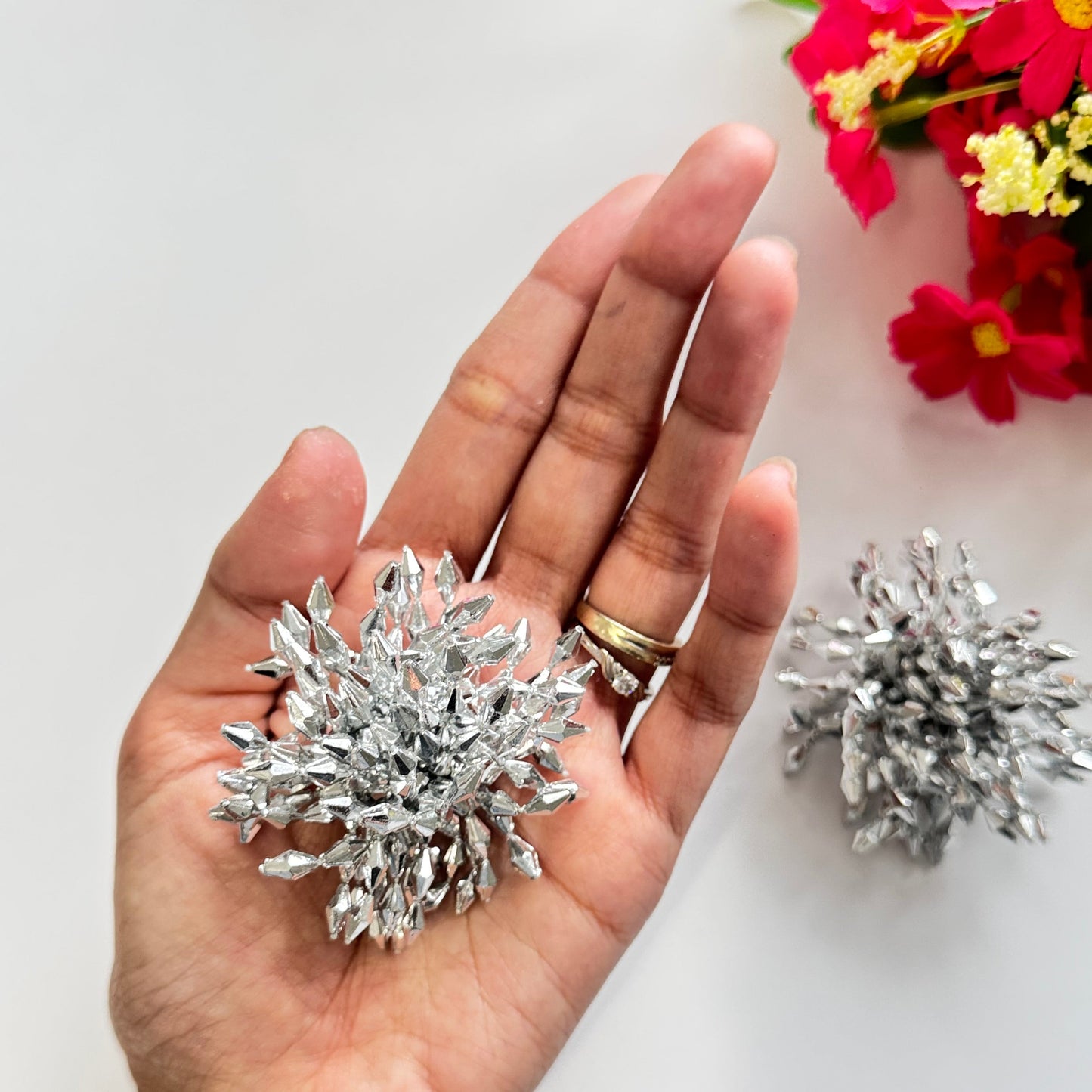Introducing our Dazzling Crystal Burst Earrings – the epitome of elegance and bold glamour!These statement earrings feature a striking explosion of silver-toned crystals, intricately arranged to reflect light from every angle.
