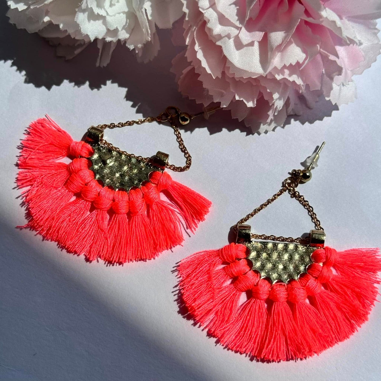 Vibrant and bold, these tassel earrings blend boho charm with a touch of gold for a statement-making look.