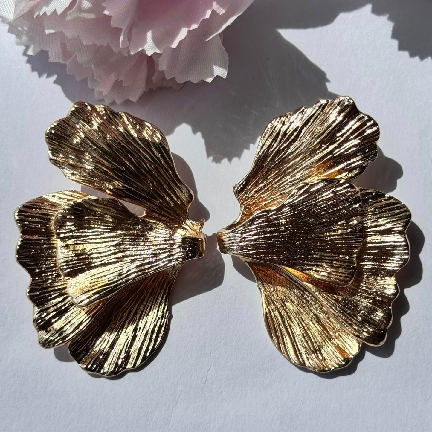 Elegant gold floral statement earrings—textured, nature-inspired, and perfect for any occasion.