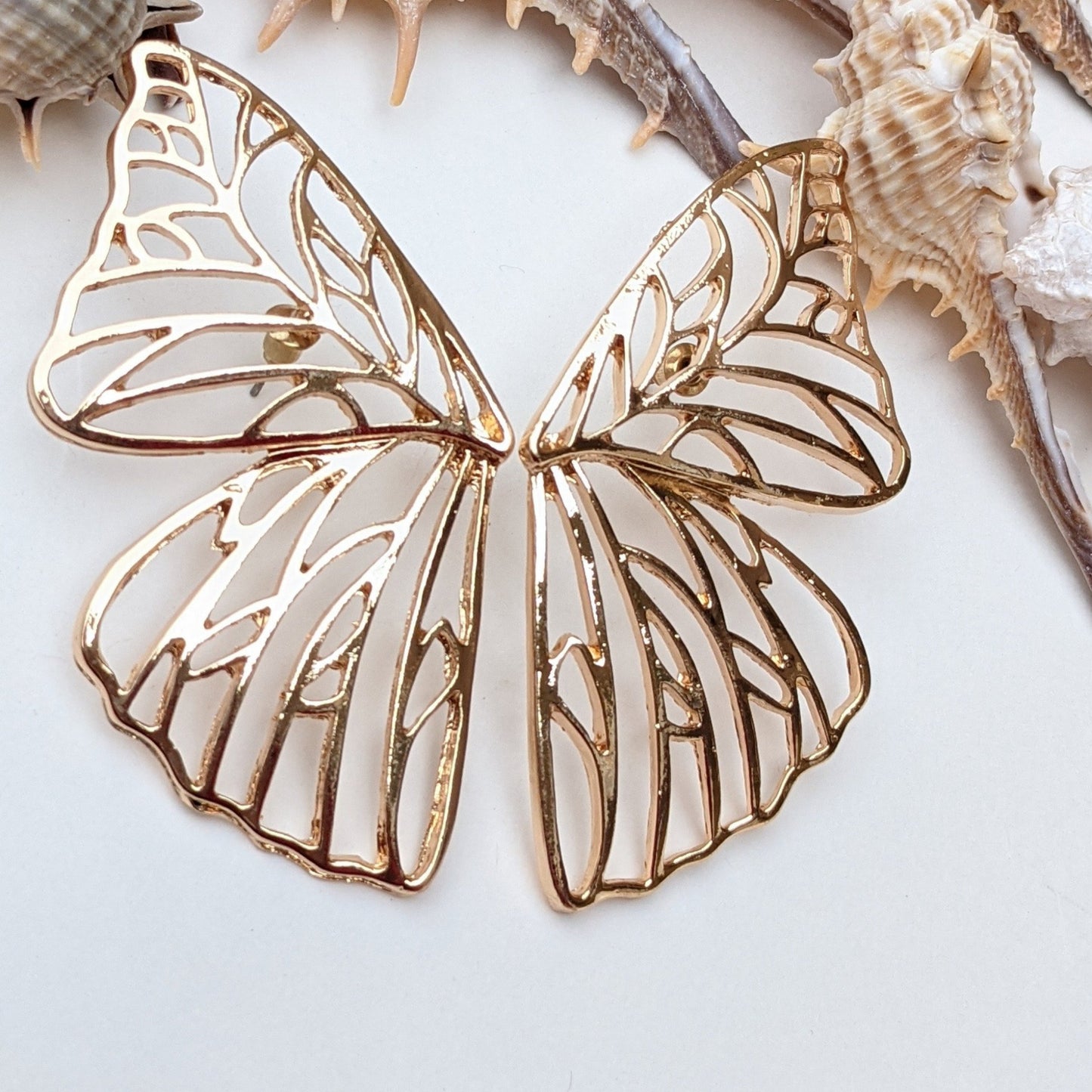 Wear the magic of transformation! These gold butterfly wing earrings are a stunning blend of elegance and whimsy, designed to make you feel effortlessly enchanting. Lightweight, radiant, and a true conversation starter—shop now and let your style take flight!