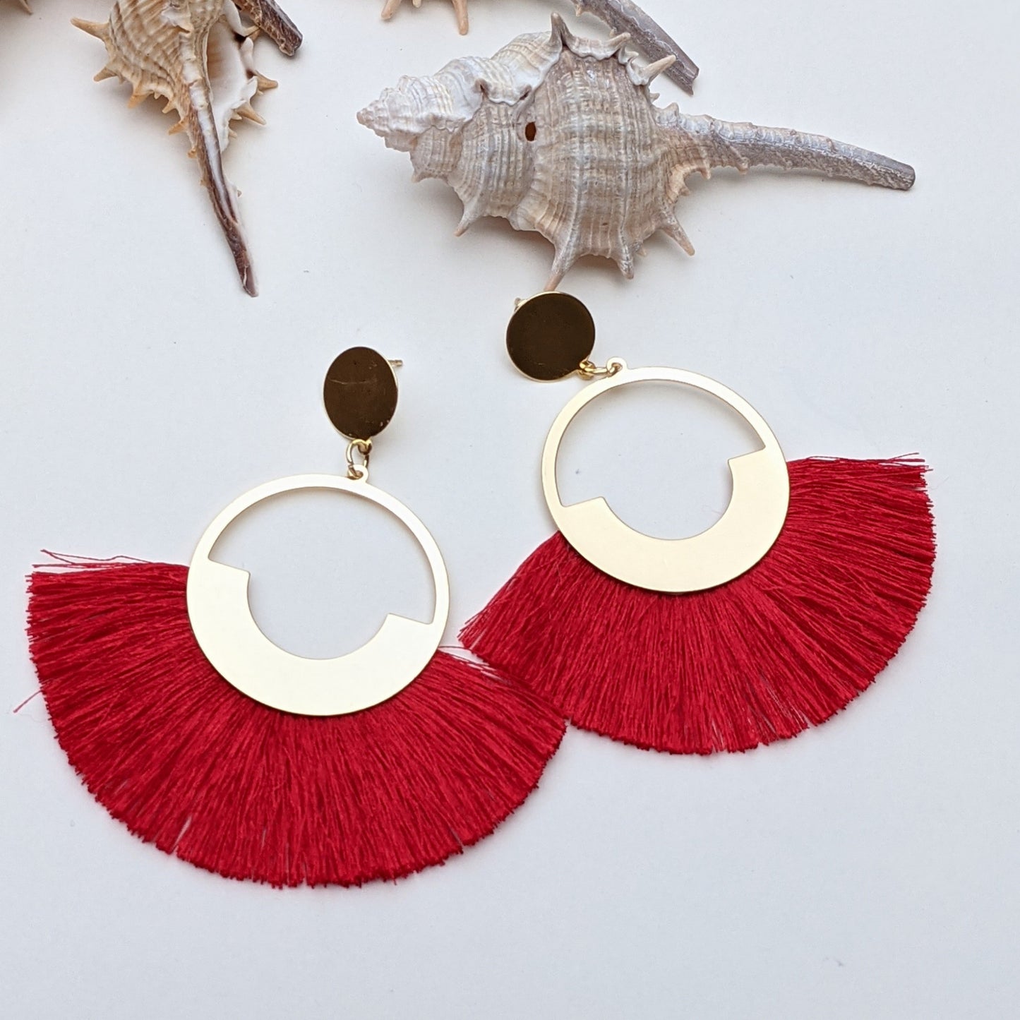 Dolly is a beautiful bold fringe tassel earring! This bold tassel earrings featuring lots of vibrant colors hung on a textural fringe metal, perfect to match and add as a statement earring to any outfit. You can use this fan tassel earring to add extra fun colors to your looks.