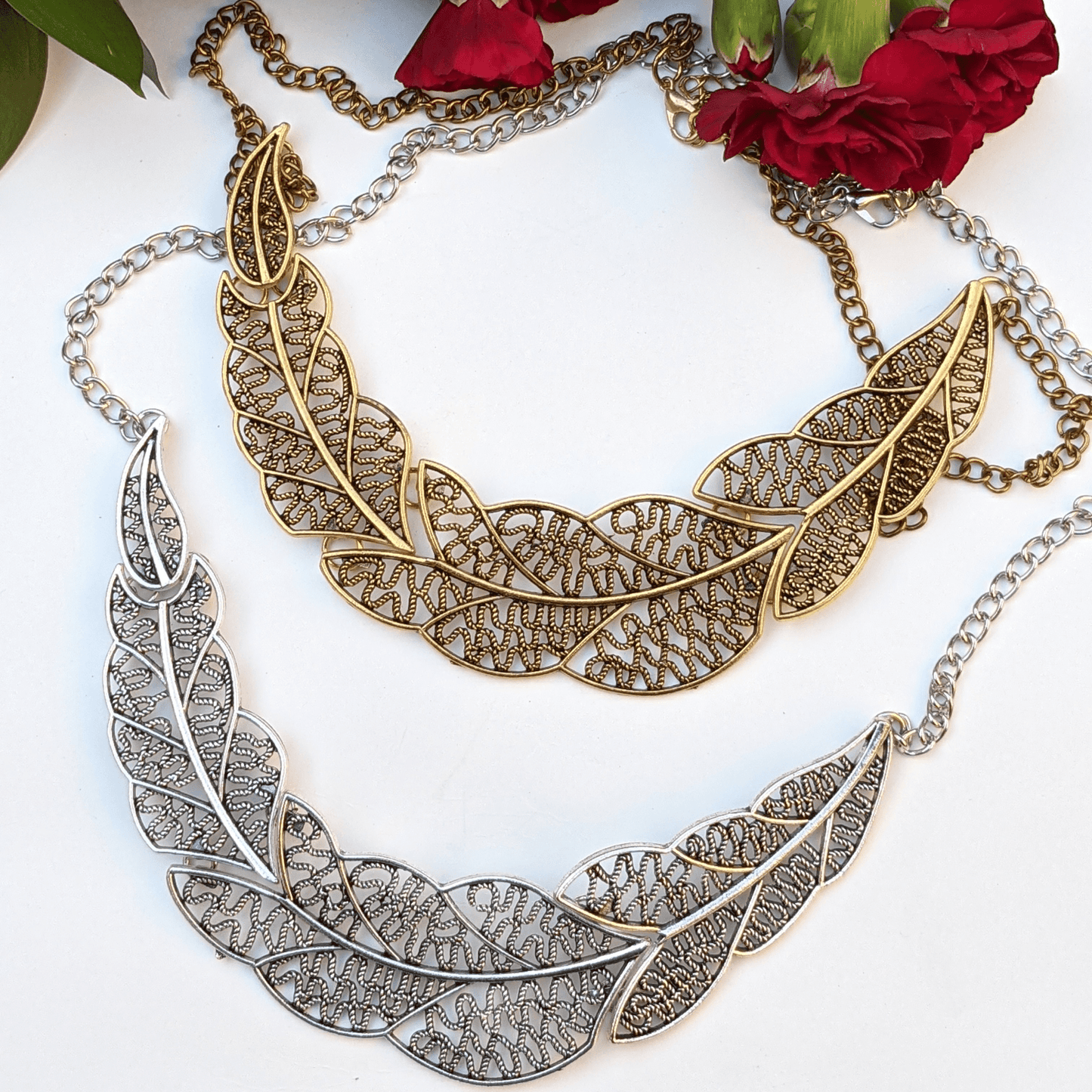 Elevate your style with our exquisite filigree leaf statement necklace, available in gold and silver tones. Designed for elegance and sophistication, this nature-inspired piece is perfect for any occasion.