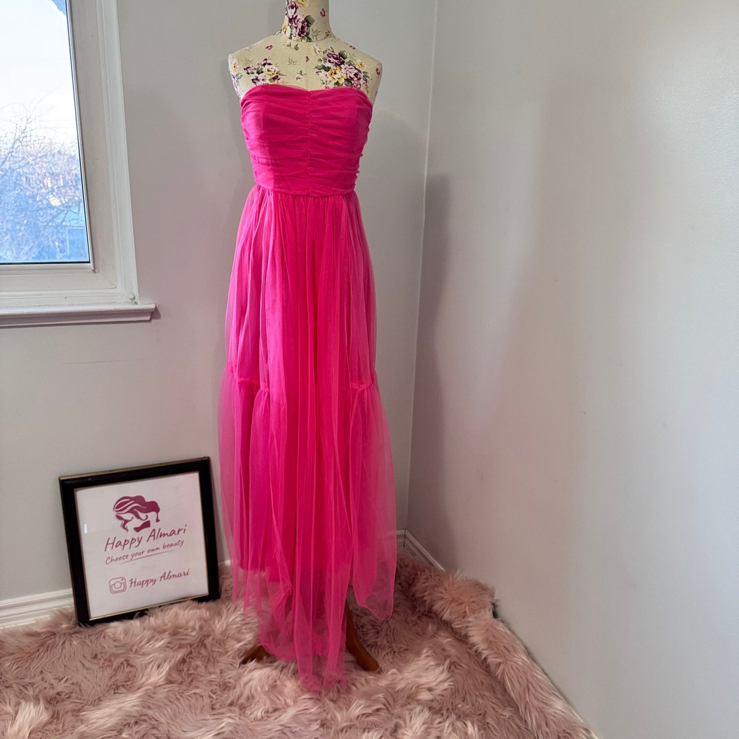 Turn heads and steal the spotlight in this breathtaking hot pink tulle gown, designed for those who dare to stand out. Featuring a strapless ruched bodice that flatters every curve and a flowing layered tulle skirt that moves with elegance, this dress is the ultimate statement piece for proms, weddings, gala nights, or any special occasion. The vibrant color radiates confidence and charm, making you the center of attention wherever you go. 