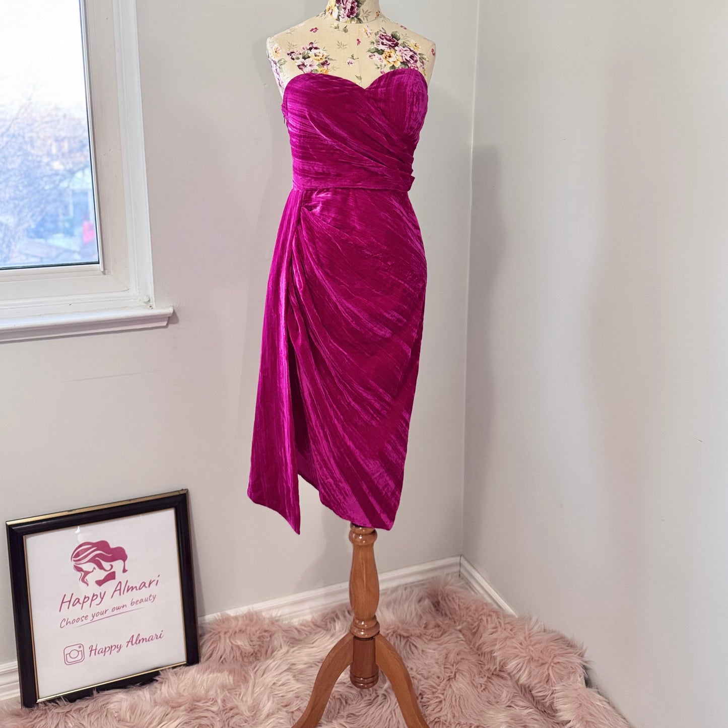 Turn heads in this stunning fuchsia velvet gown, designed to exude confidence and effortless glamour. Featuring a sculpted sweetheart neckline and expertly draped fabric that cinches at the waist, this dress enhances your natural silhouette with a flattering fit. The asymmetrical ruched detailing cascades into a flowing side drape, adding movement and dimension for a show-stopping effect.