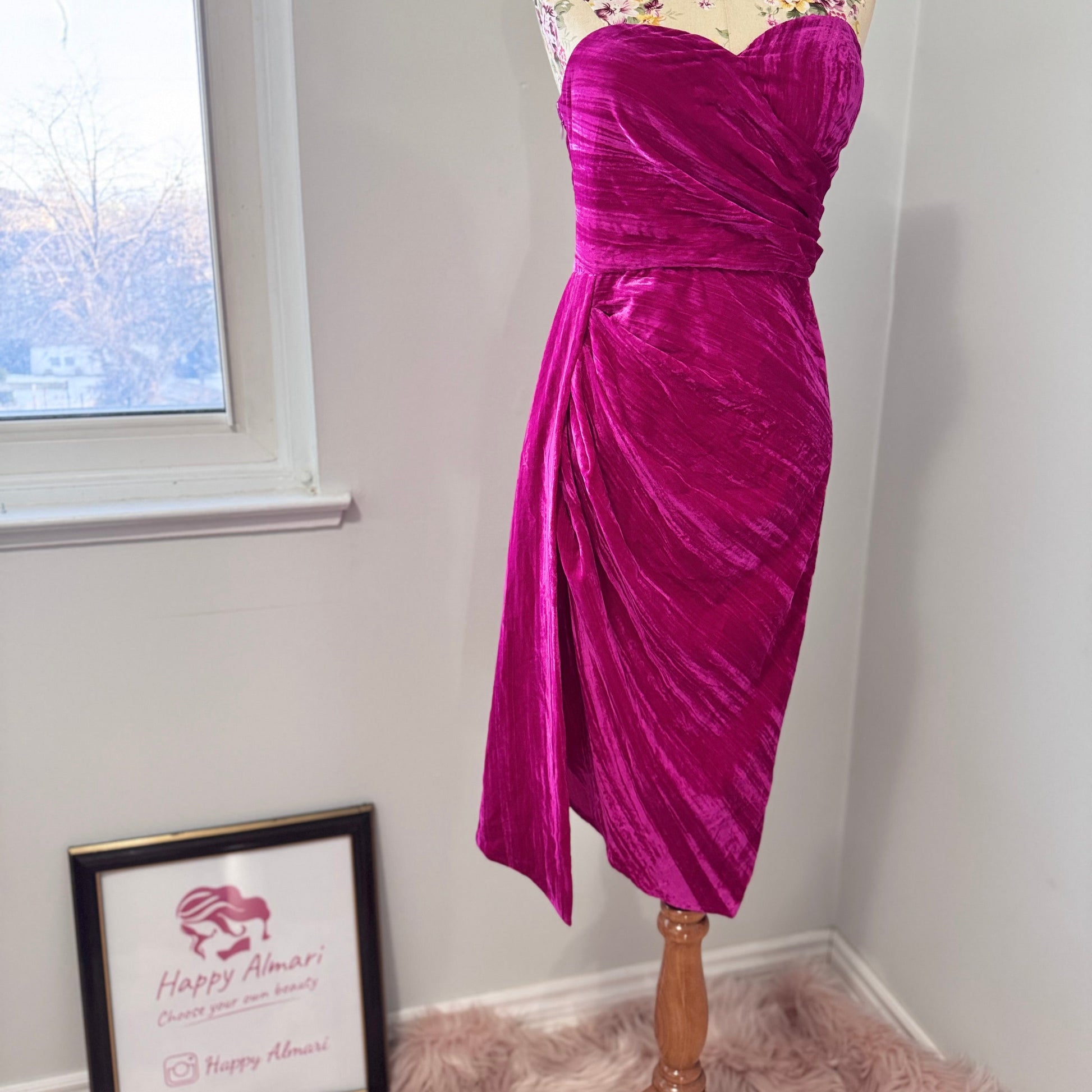 Turn heads in this stunning fuchsia velvet gown, designed to exude confidence and effortless glamour. Featuring a sculpted sweetheart neckline and expertly draped fabric that cinches at the waist, this dress enhances your natural silhouette with a flattering fit. The asymmetrical ruched detailing cascades into a flowing side drape, adding movement and dimension for a show-stopping effect.