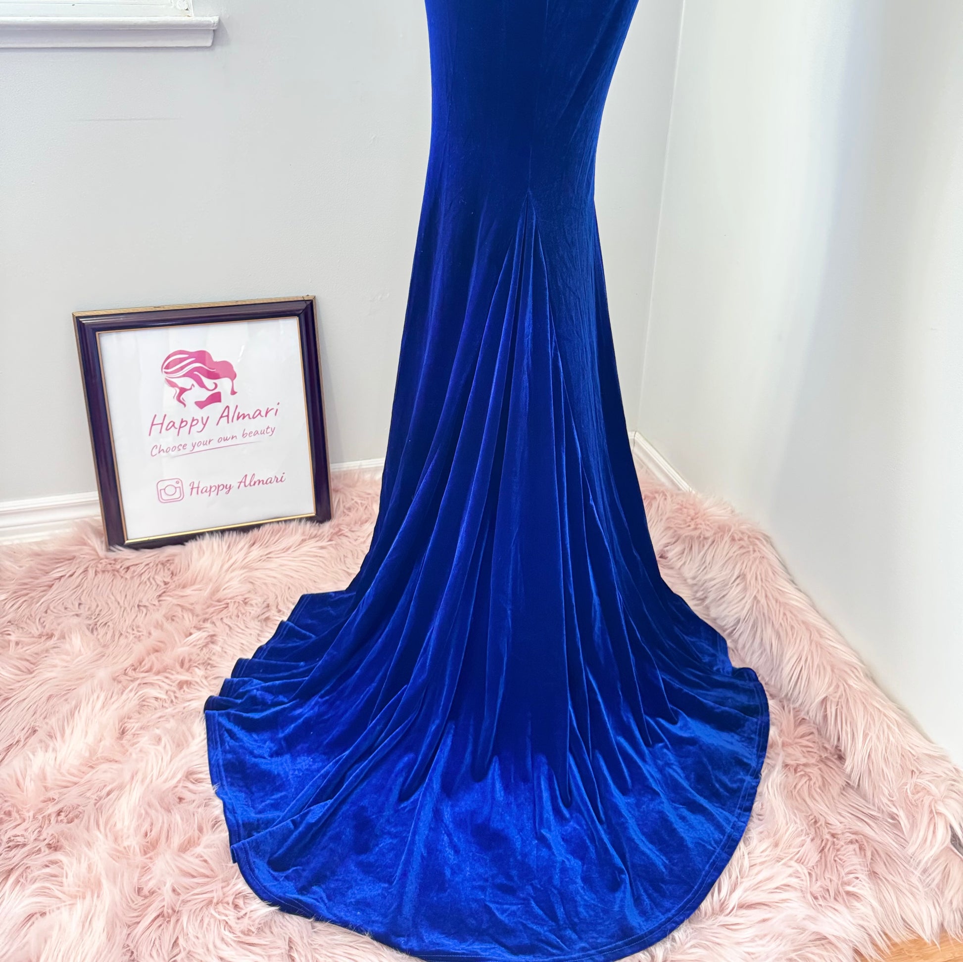 Step into timeless elegance with this breathtaking previously cherished royal blue velvet evening gown, designed to turn heads at any event. Crafted from rich, ultra-soft velvet, this figure-hugging masterpiece features a structured corset bodice with delicate pleated detailing that accentuates your silhouette. The sweetheart neckline adds a touch of romance, while the flowing skirt with a sultry thigh-high slit creates the perfect balance of sophistication and allure. In perfect condition.
