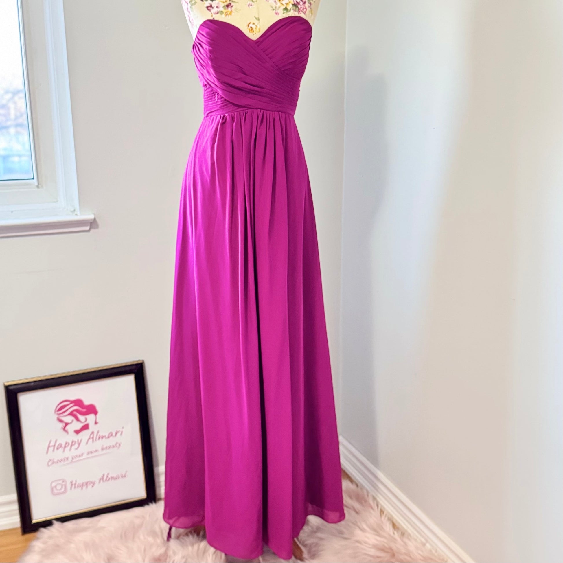 Make a statement in this breathtaking pre-owned, pristine-condition magenta gown, designed to turn heads at any formal event. Featuring a timeless sweetheart neckline with elegant ruched detailing, this floor-length dress flows effortlessly, creating a stunning silhouette that flatters every figure. The flowy chiffon fabric adds a touch of romance, perfect for weddings, galas, proms, or evening soirées. 
