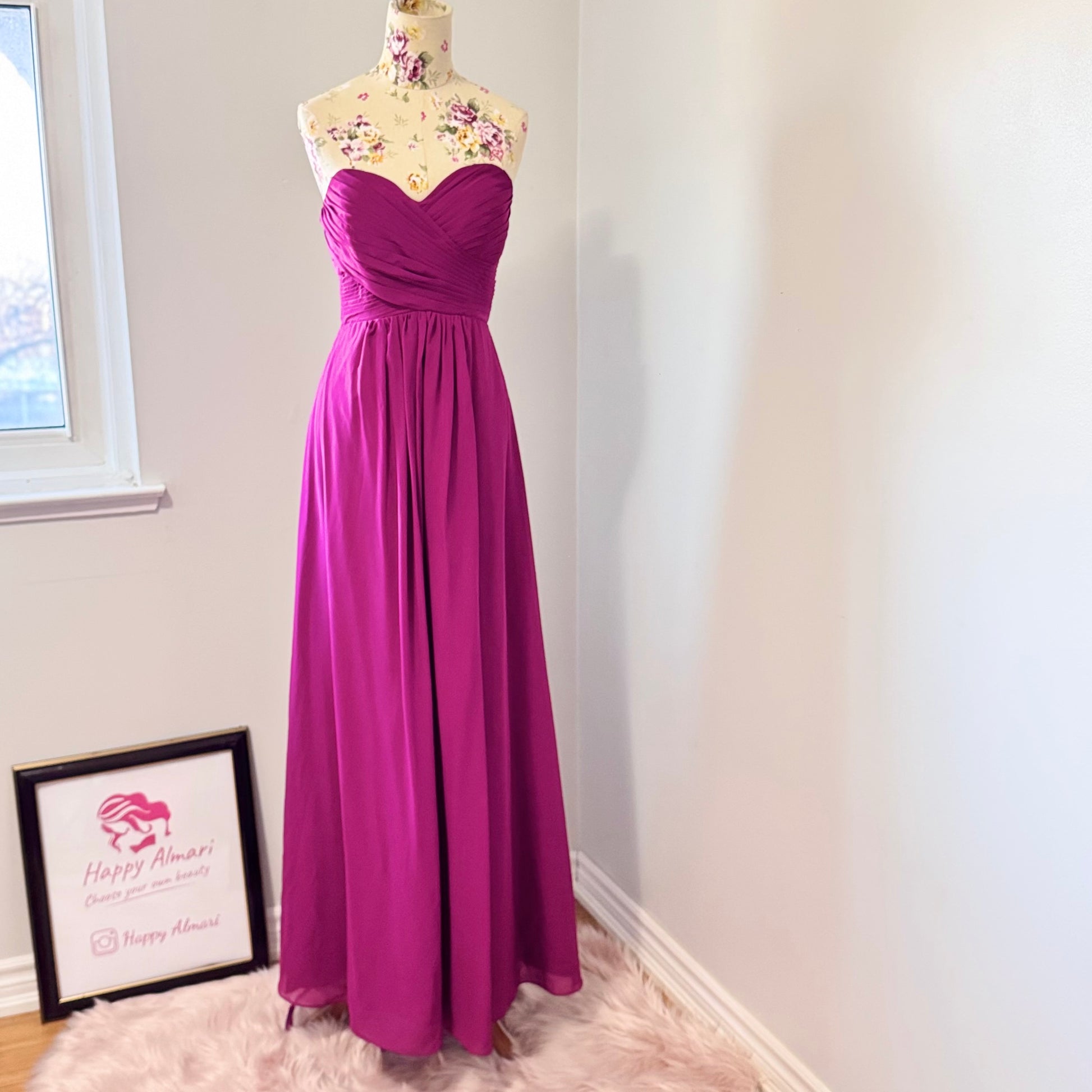 Make a statement in this breathtaking pre-owned, pristine-condition magenta gown, designed to turn heads at any formal event. Featuring a timeless sweetheart neckline with elegant ruched detailing, this floor-length dress flows effortlessly, creating a stunning silhouette that flatters every figure. The flowy chiffon fabric adds a touch of romance, perfect for weddings, galas, proms, or evening soirées. 