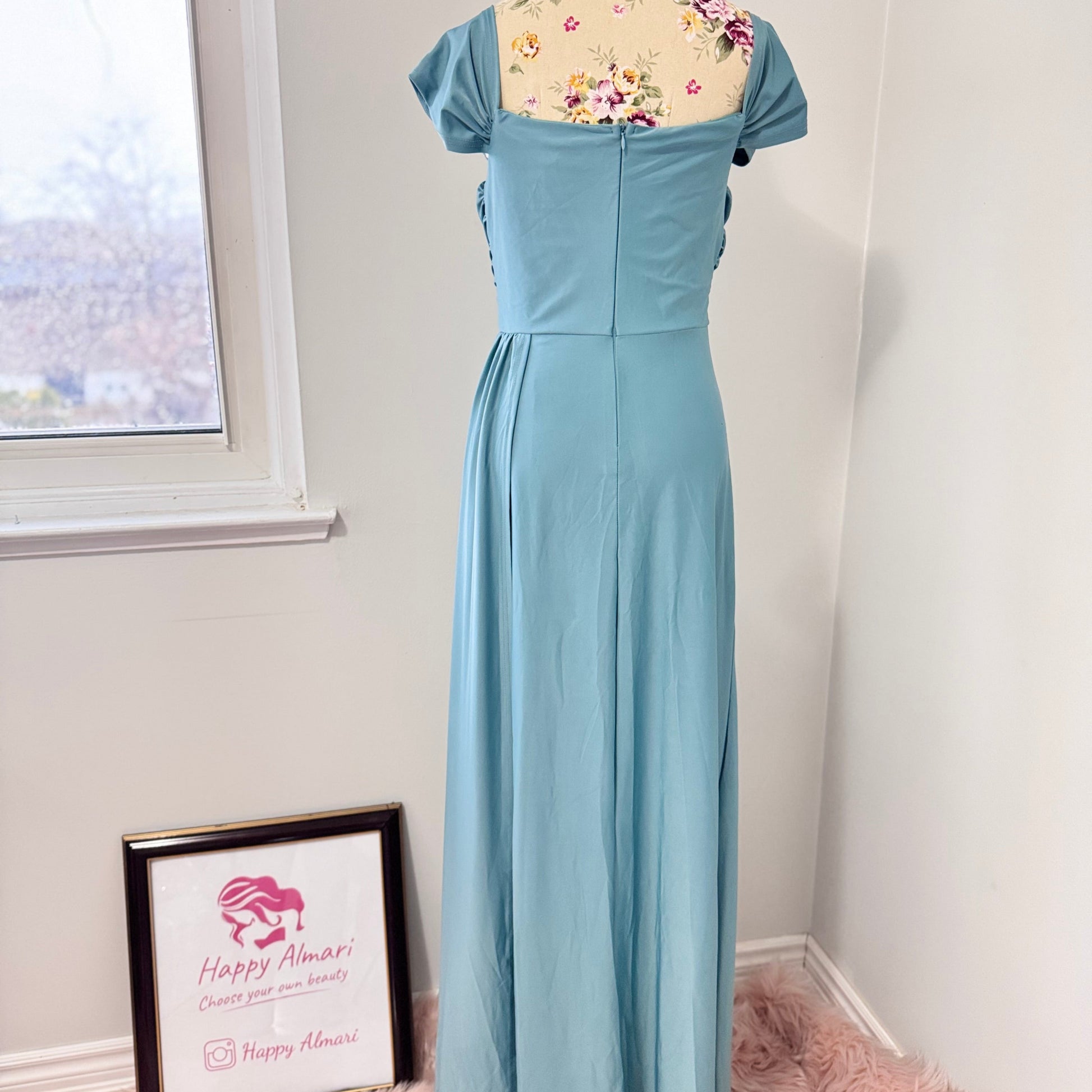 Turn heads with this stunning ocean-blue draped evening gown, designed to flatter every curve with its elegant ruched bodice and flowing silhouette. Featuring an off-shoulder neckline and a sultry side slit, this dress is perfect for weddings, formal events, and special occasions where making a statement is a must! The smooth, high-quality fabric offers a graceful drape, ensuring you move with confidence and poise.