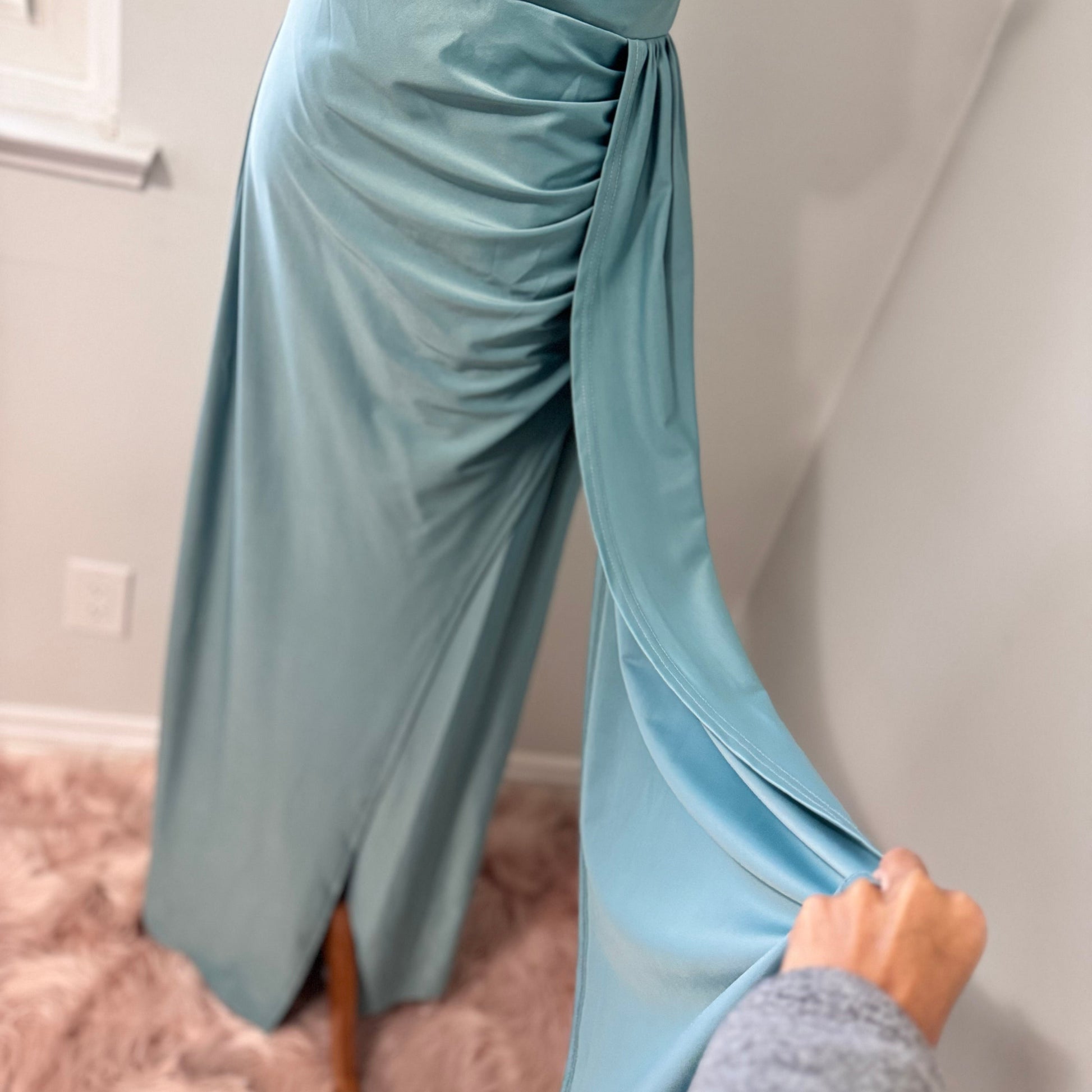 Turn heads with this stunning ocean-blue draped evening gown, designed to flatter every curve with its elegant ruched bodice and flowing silhouette. Featuring an off-shoulder neckline and a sultry side slit, this dress is perfect for weddings, formal events, and special occasions where making a statement is a must! The smooth, high-quality fabric offers a graceful drape, ensuring you move with confidence and poise.