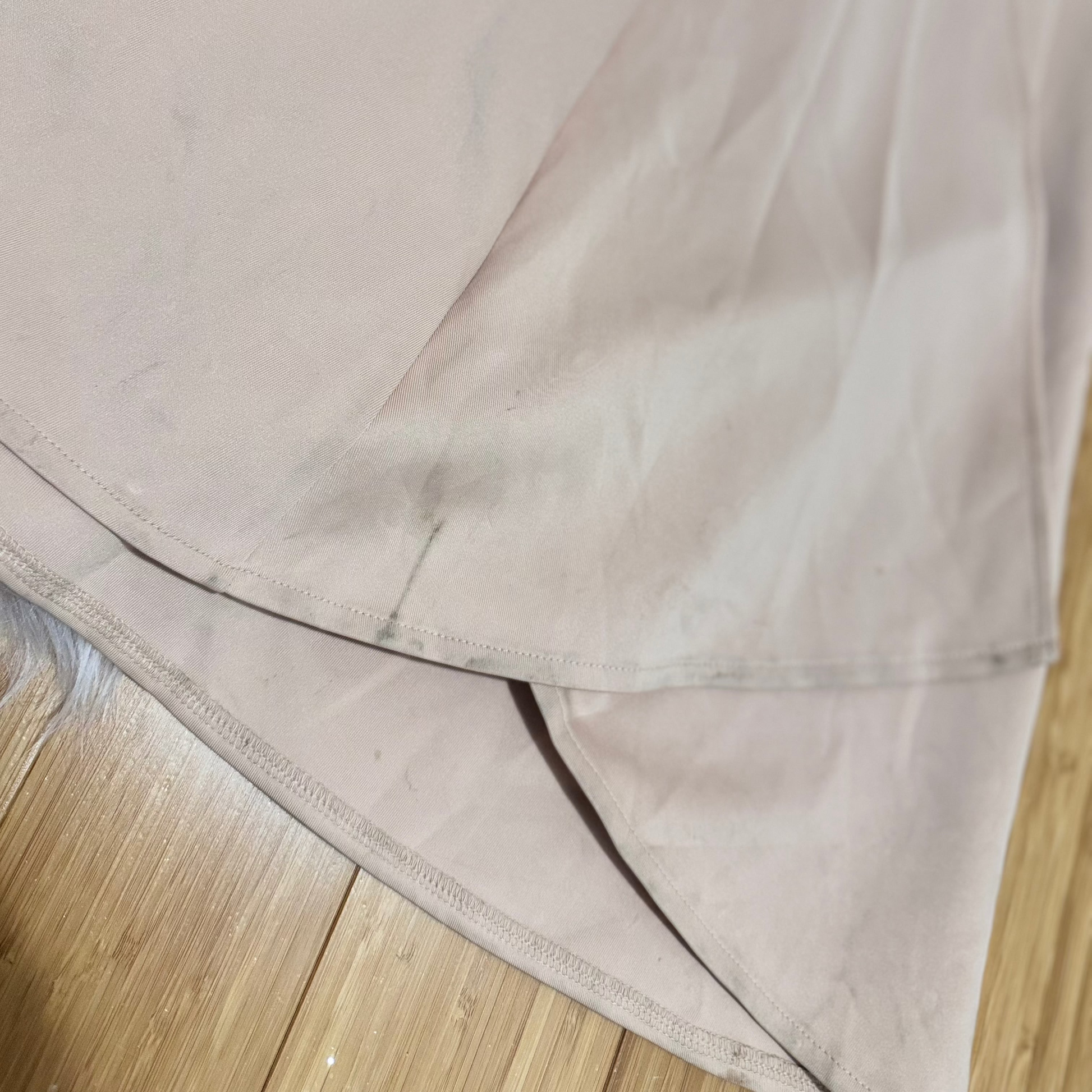 This dress has been gently loved and remains in good condition. There is a light mark near the hem that is barely noticeable and can be easily refreshed with a wash.