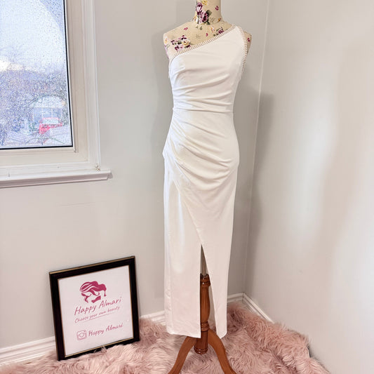 Elevate your style with this stunning white one-shoulder midi dress, designed to make a statement at any event. Featuring an asymmetrical neckline with elegant pearl-like trim, a flattering ruched waist, and a sultry front slit, this dress exudes sophistication and charm. Crafted from high-quality fabric, it drapes beautifully to accentuate your silhouette. 