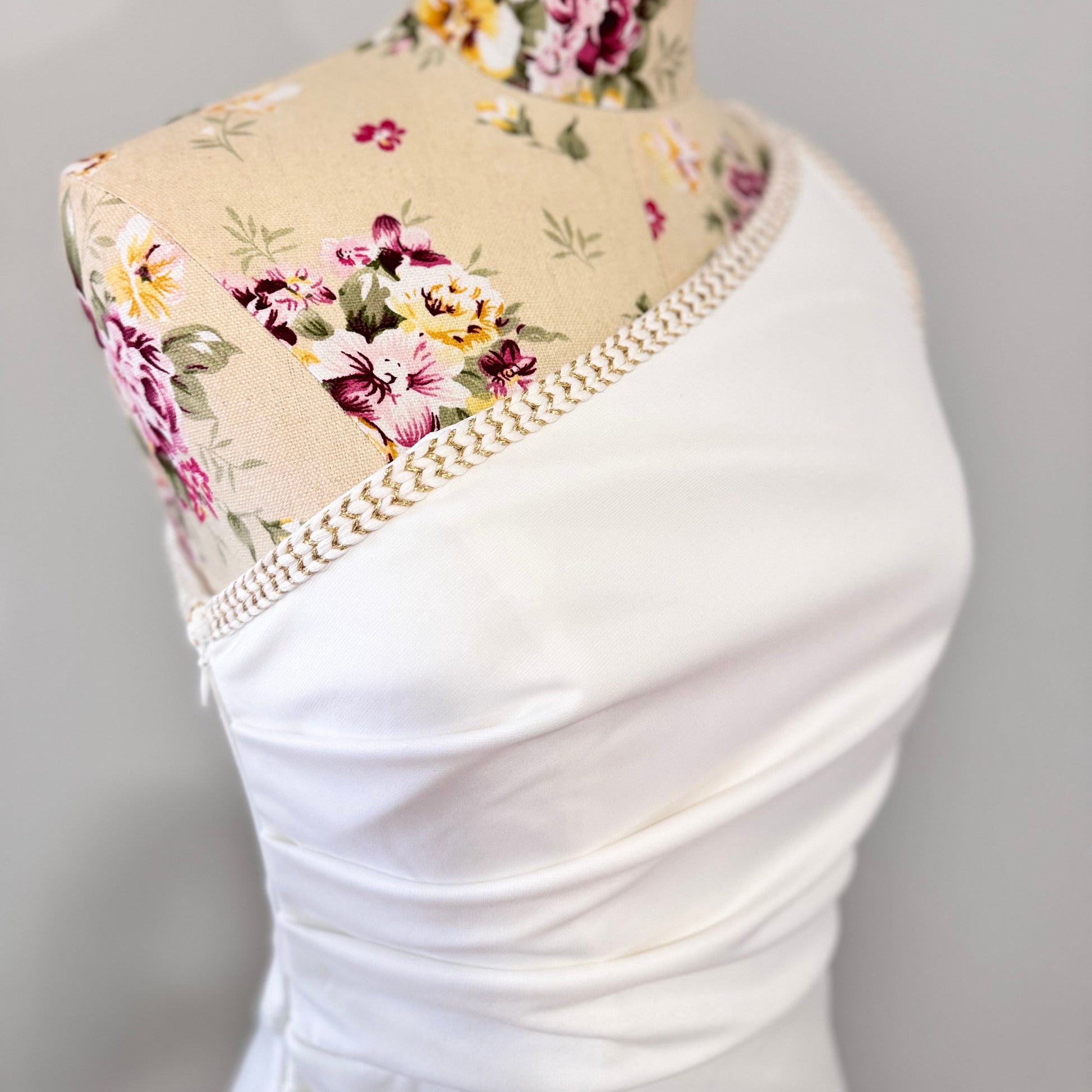 Elevate your style with this stunning white one-shoulder midi dress, designed to make a statement at any event. Featuring an asymmetrical neckline with elegant pearl-like trim, a flattering ruched waist, and a sultry front slit, this dress exudes sophistication and charm. Crafted from high-quality fabric, it drapes beautifully to accentuate your silhouette. 