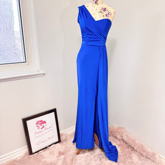Step into elegance with this stunning cobalt blue one-shoulder gown, designed to turn heads at any special occasion. Featuring a flattering ruched bodice that accentuates your curves and a flowing floor-length silhouette with a dramatic side slit, this dress exudes confidence and sophistication. The soft, high-quality fabric drapes beautifully, creating an effortlessly chic look. 