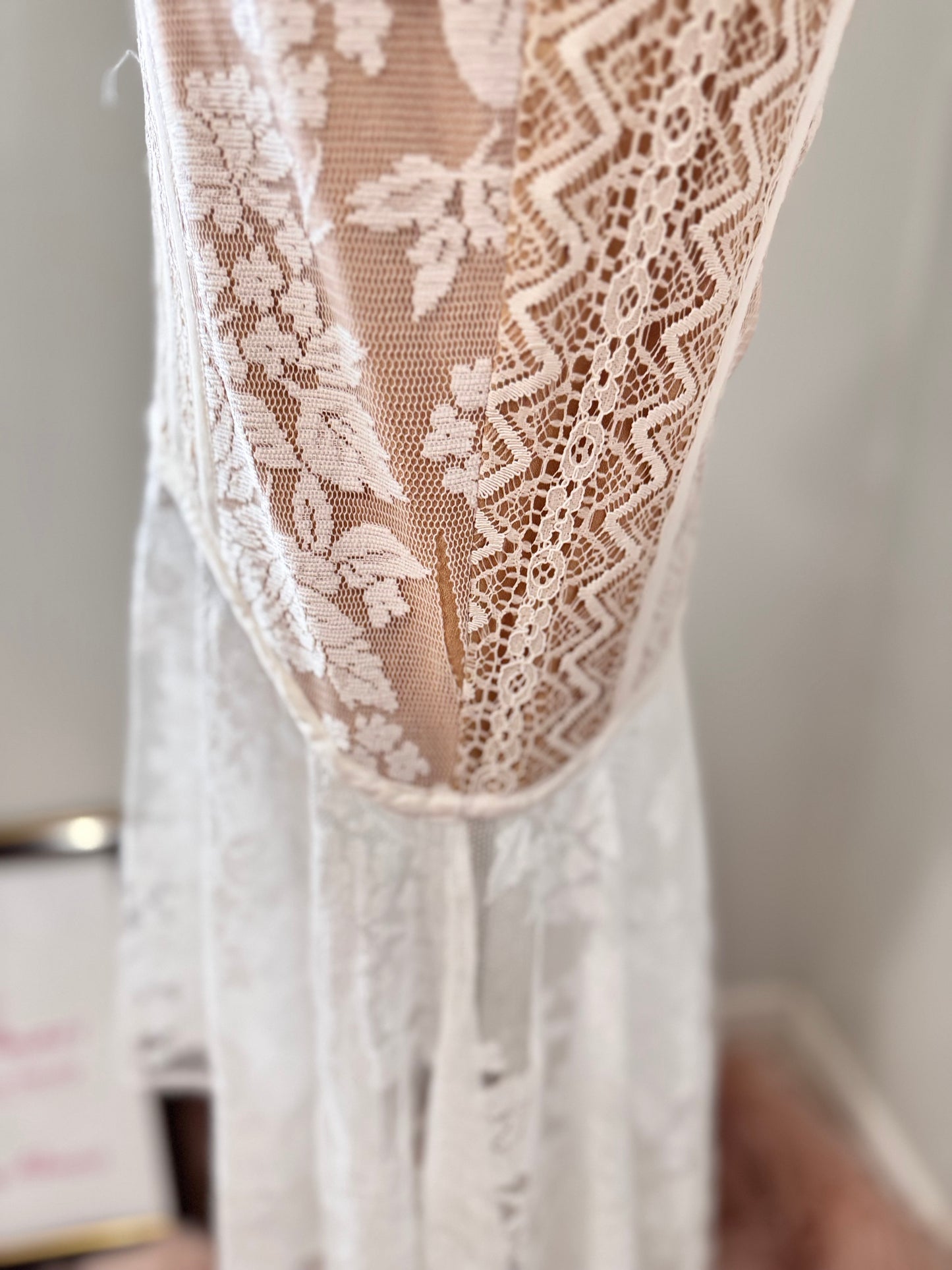 It has a slight separation in the tear near the hem as shown in the picture and video—a minor detail that remains virtually unnoticeable when worn.