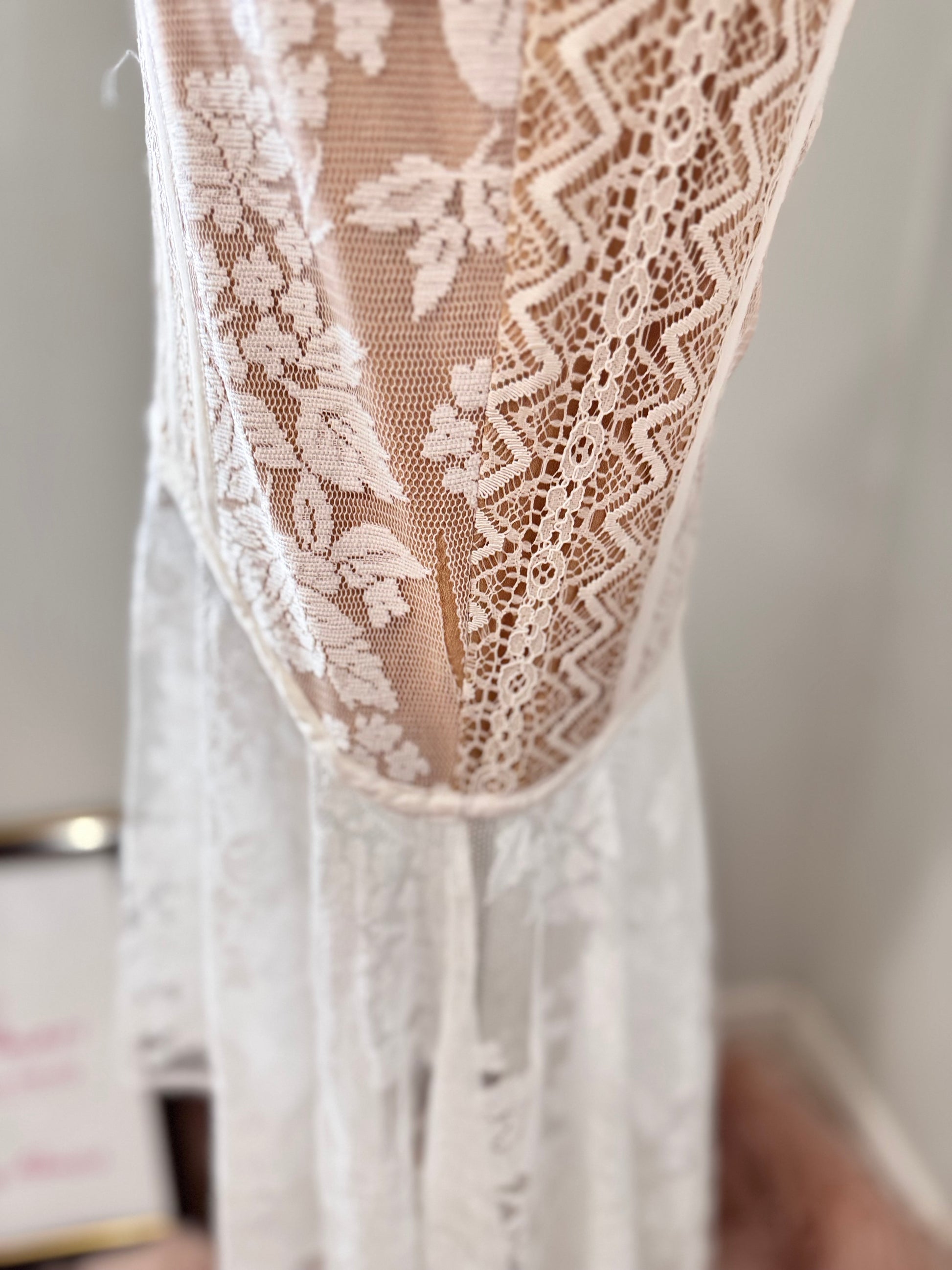 It has a slight separation in the tear near the hem as shown in the picture and video—a minor detail that remains virtually unnoticeable when worn.