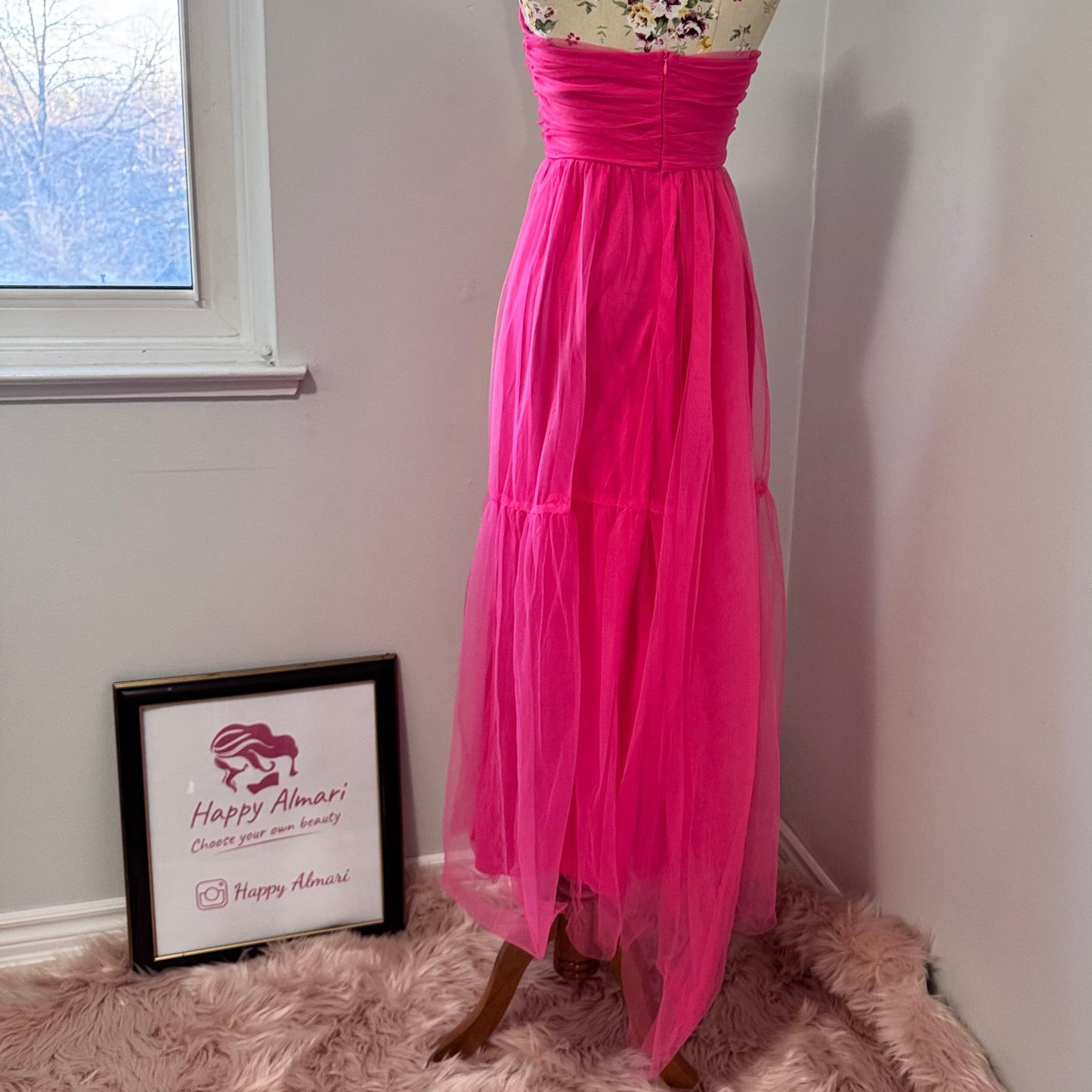 Turn heads and steal the spotlight in this breathtaking hot pink tulle gown, designed for those who dare to stand out. Featuring a strapless ruched bodice that flatters every curve and a flowing layered tulle skirt that moves with elegance, this dress is the ultimate statement piece for proms, weddings, gala nights, or any special occasion. The vibrant color radiates confidence and charm, making you the center of attention wherever you go. 