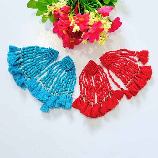  Crafted with intricate seed bead detailing and cascading strands of smooth, polished beads, these earrings exude a bold, eye-catching charm. The vibrant hues of turquoise and fiery red add a striking pop of color to any outfit, making them the perfect accessory for special occasions, beach vacations, or everyday glamour. 