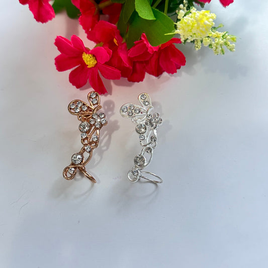 Elevate your earring collection with this exquisite, gold-tone crystal butterfly ear cuff, a true embodiment of elegance and sophistication.