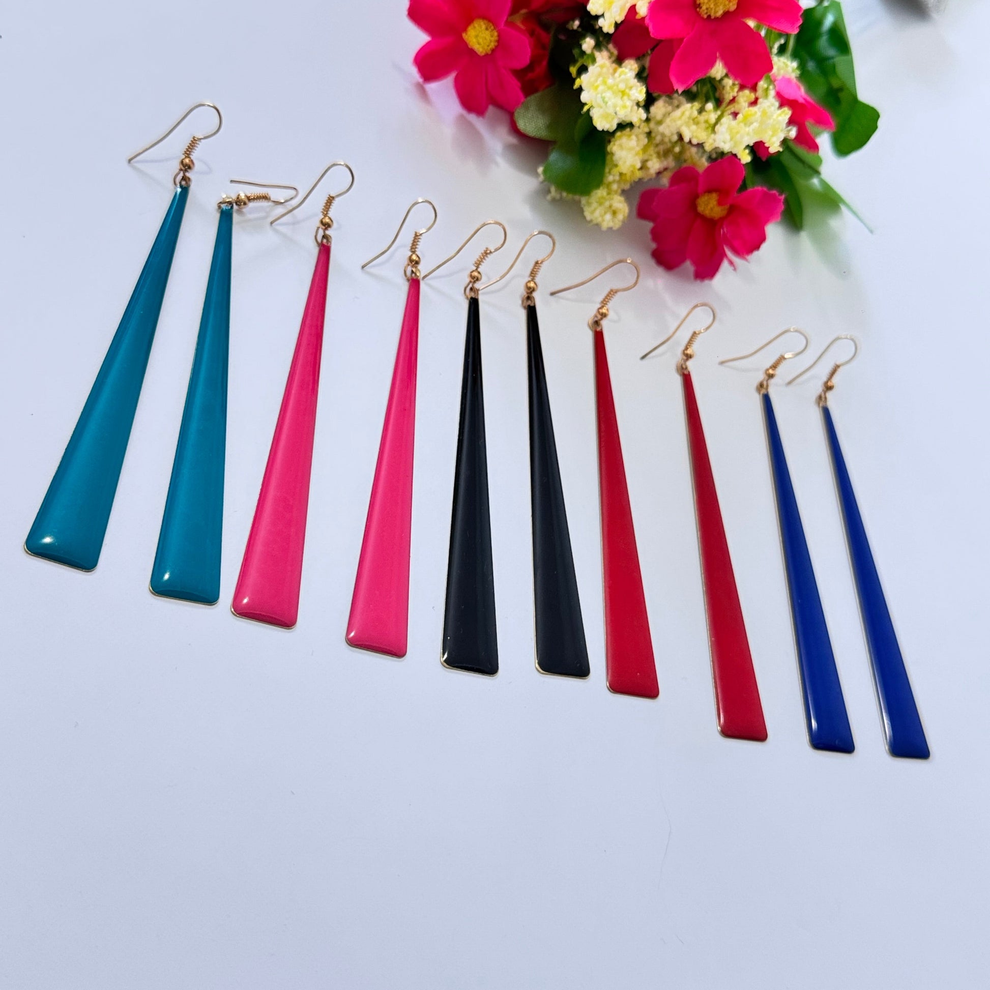 Upgrade your accessory game with these sleek and sophisticated long drop earrings, designed for the modern fashionista! Featuring a minimalist, tapered silhouette, these earrings exude elegance with a bold, contemporary twist. 