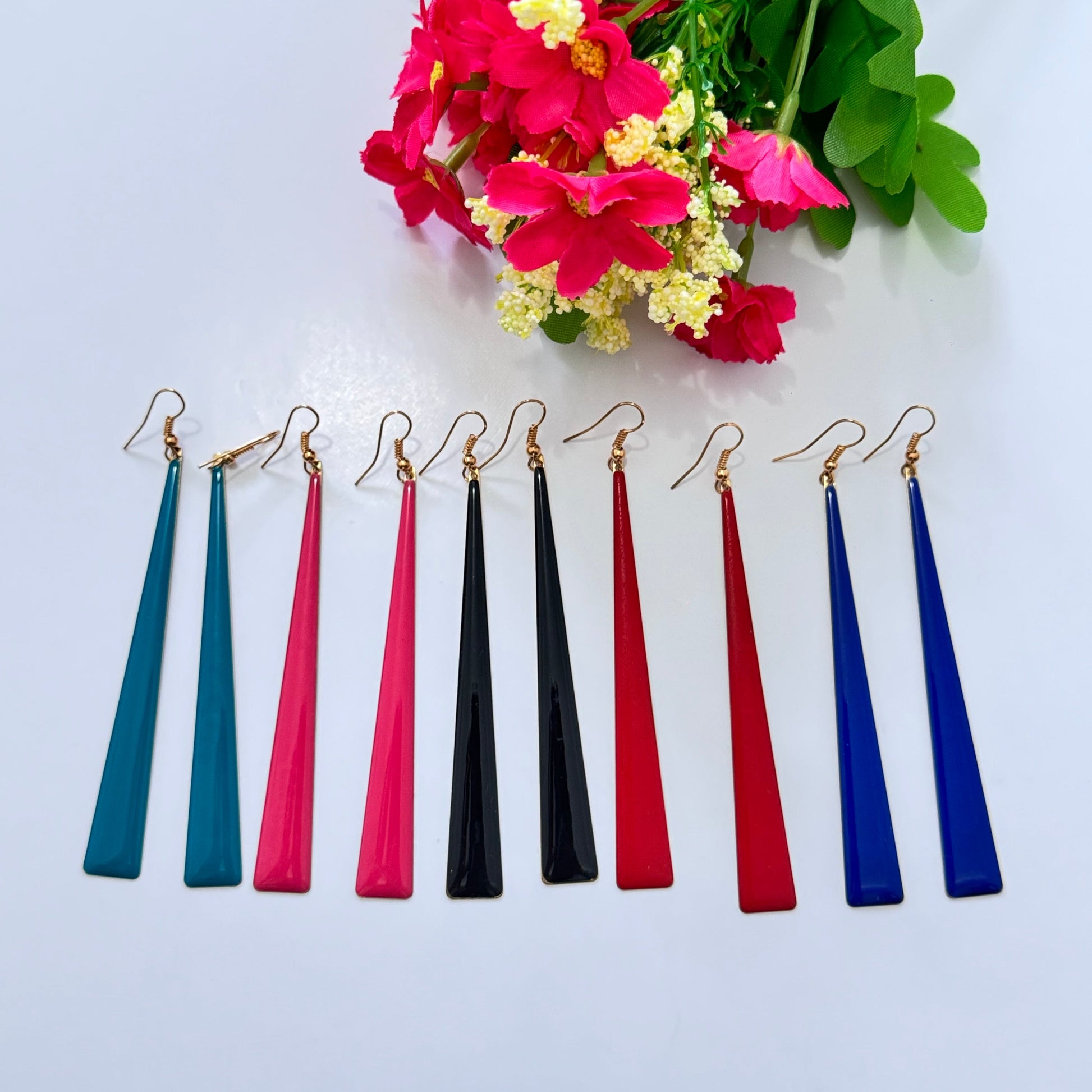 Upgrade your accessory game with these sleek and sophisticated long drop earrings, designed for the modern fashionista! Featuring a minimalist, tapered silhouette, these earrings exude elegance with a bold, contemporary twist. 