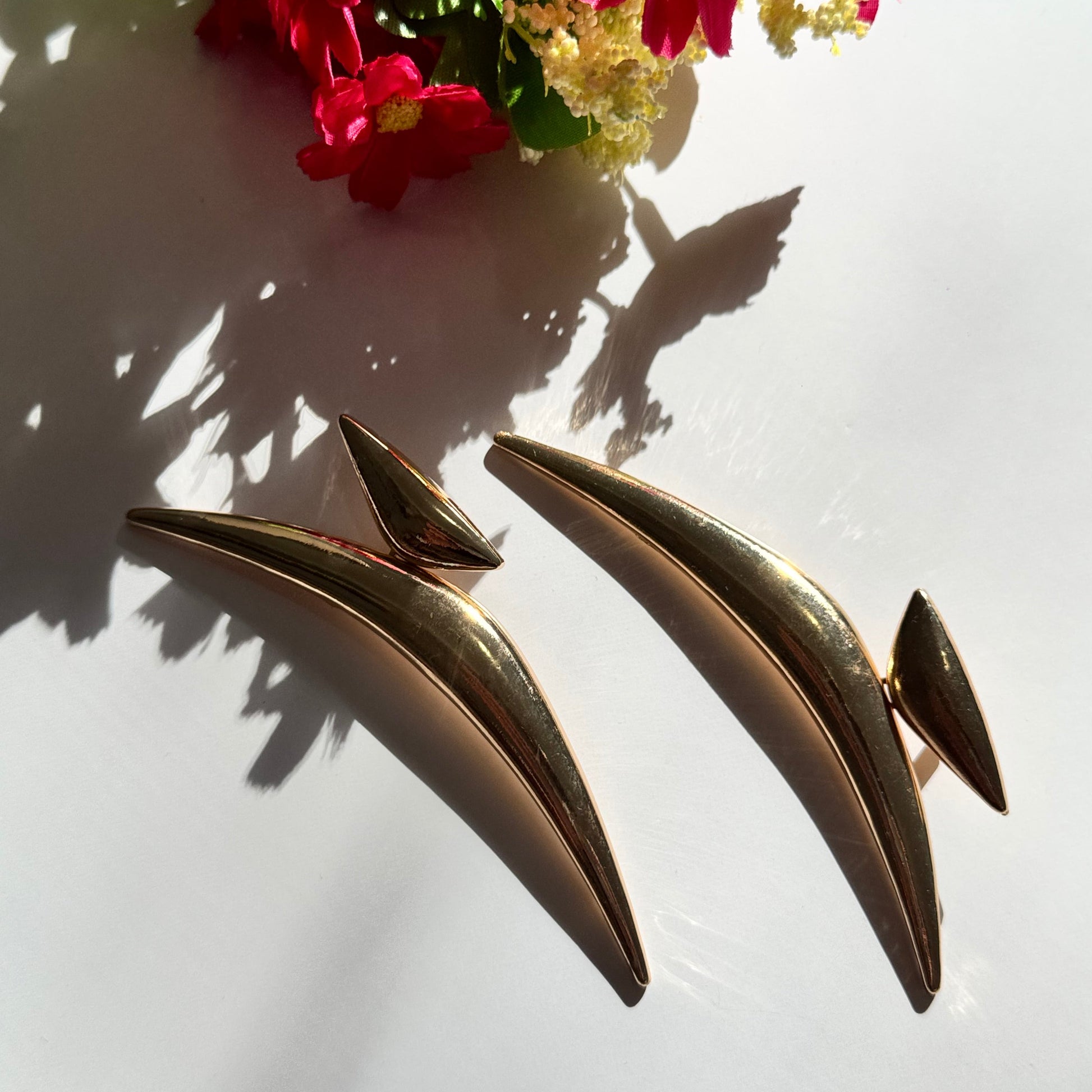 Elevate your style with these semi-crescent statement earrings, a perfect blend of modern elegance and celestial allure. Crafted in radiant gold and sleek silver finishes, these sculptural earrings feature a bold, curved design inspired by the fluidity of motion and the mystique of the crescent moon. 