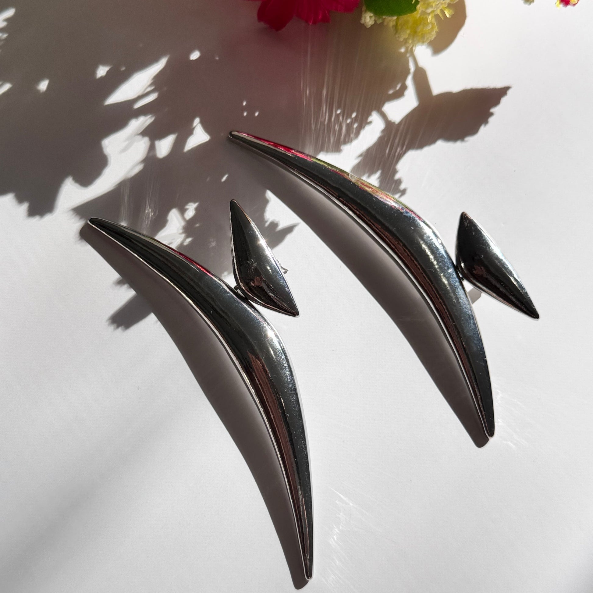 Elevate your style with these semi-crescent statement earrings, a perfect blend of modern elegance and celestial allure. Crafted in radiant gold and sleek silver finishes, these sculptural earrings feature a bold, curved design inspired by the fluidity of motion and the mystique of the crescent moon. 