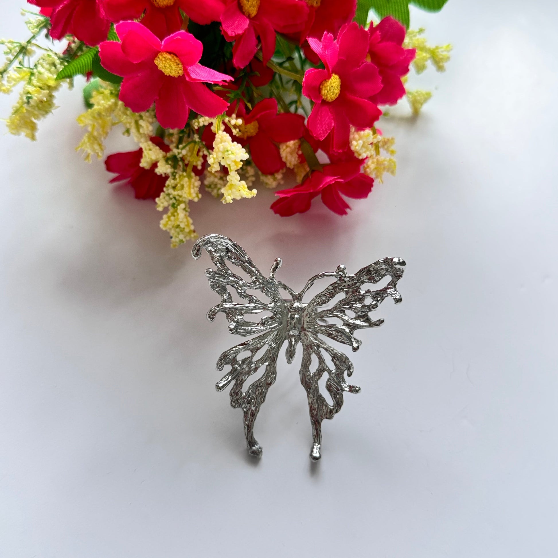 Elevate your style with this breathtaking silver butterfly statement adjustable ring, designed to captivate with its intricate details and bold presence. Crafted with a textured metal finish, this striking piece embodies grace, freedom, and transformation, making it the perfect accessory for those who love to express their individuality.