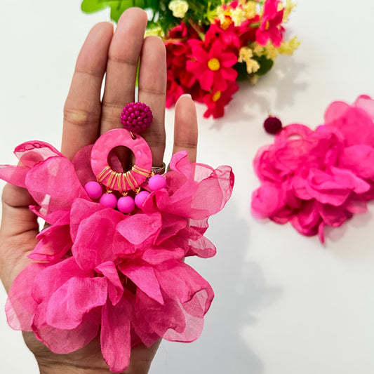 Unleash your inner diva with these stunning hot pink floral statement earrings, designed to turn heads and make every outfit pop! Featuring voluminous chiffon petals, gold-tone accents, and beaded details, these oversized earrings are the perfect mix of elegance and boldness. 