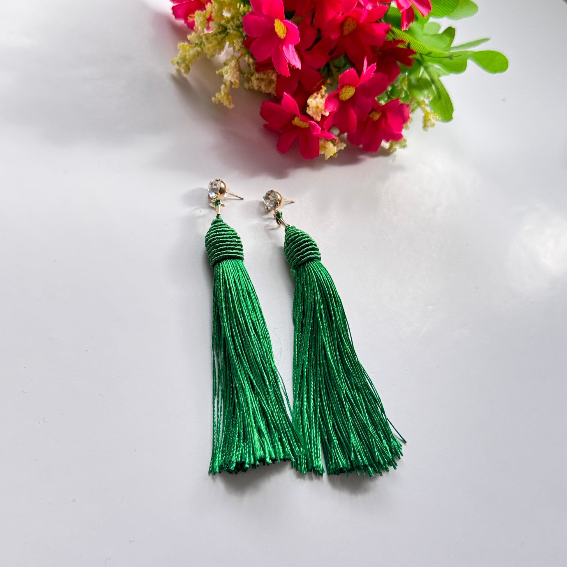 Turn heads with these stunning emerald green tassel earrings, designed to bring a bold and vibrant touch to your style. The silky, flowing tassels create an elegant movement, adding a dramatic yet sophisticated flair to any outfit. Suspended from a shimmering stud, these lightweight earrings offer the perfect balance of glamour and versatility.