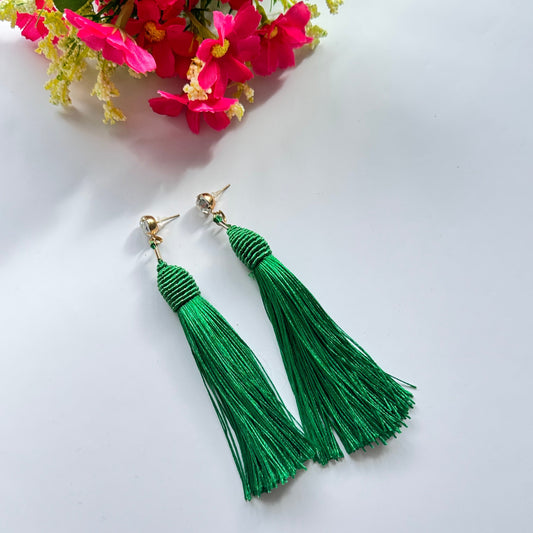 Turn heads with these stunning emerald green tassel earrings, designed to bring a bold and vibrant touch to your style. The silky, flowing tassels create an elegant movement, adding a dramatic yet sophisticated flair to any outfit. Suspended from a shimmering stud, these lightweight earrings offer the perfect balance of glamour and versatility.