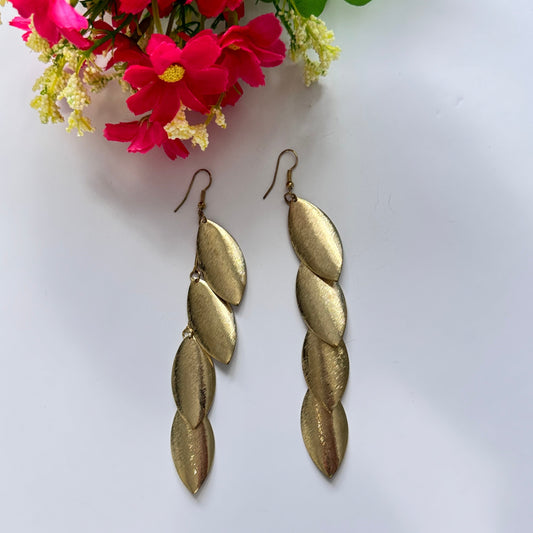 Elevate your style with these stunning gold-tone cascading leaf earrings, a perfect blend of elegance and sophistication. Designed with a sleek, brushed-metal finish, each delicate leaf dangles gracefully, creating a mesmerizing movement that catches the light with every step.