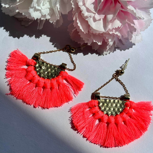 Vibrant and bold, these tassel earrings blend boho charm with a touch of gold for a statement-making look.