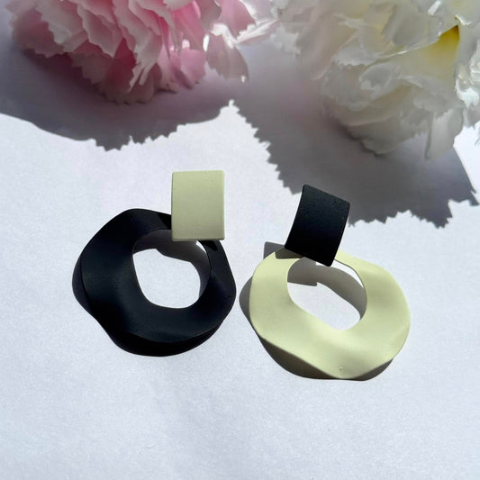 Bold and modern asymmetrical black-and-cream statement earrings – the perfect blend of elegance and edge for any outfit.