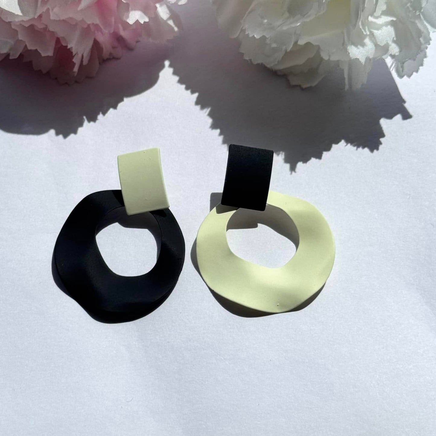 Bold and modern asymmetrical black-and-cream statement earrings – the perfect blend of elegance and edge for any outfit.