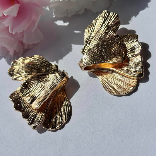 Elegant gold floral statement earrings—textured, nature-inspired, and perfect for any occasion. 