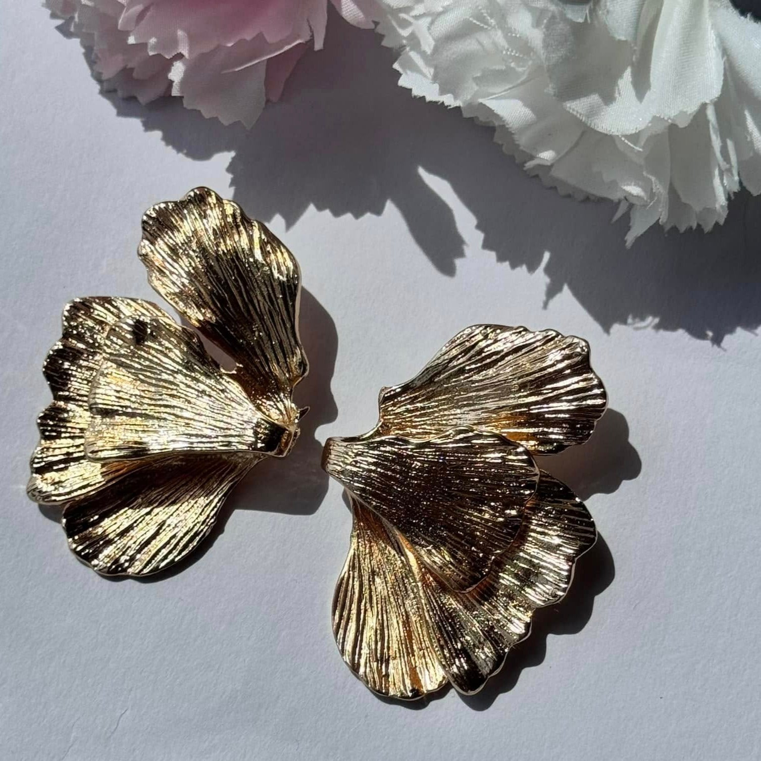 Elegant gold floral statement earrings—textured, nature-inspired, and perfect for any occasion. 