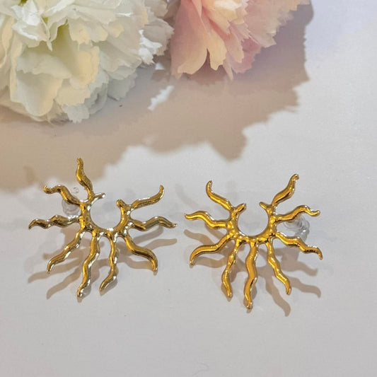 Radiate confidence with these gold sunburst statement earrings – a bold, celestial-inspired accessory for any occasion.