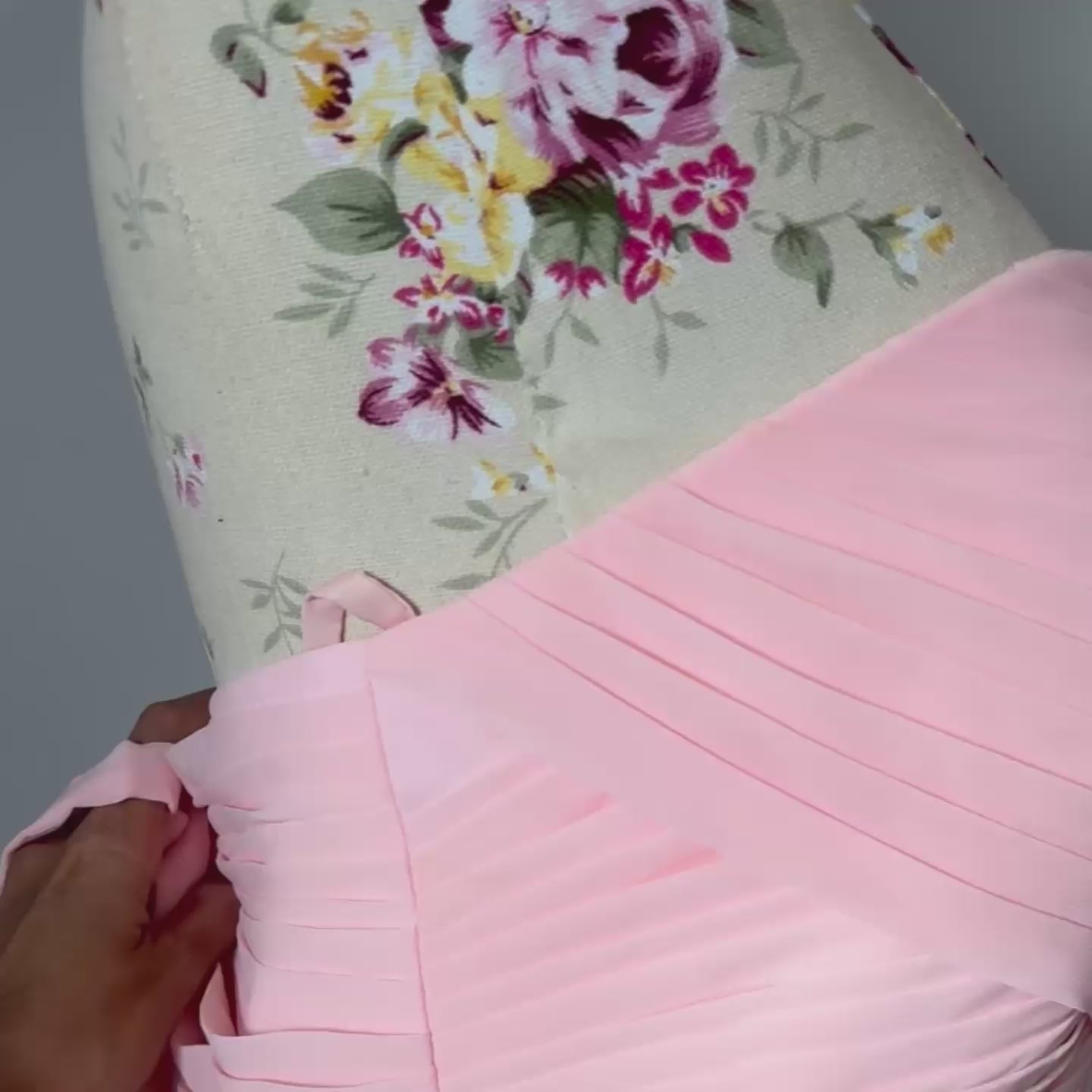 This enchanting blush pink gown is the epitome of timeless elegance, designed to make you feel effortlessly radiant at any special occasion. Featuring a flattering sweetheart neckline with delicately ruched detailing, this dress cascades into a flowy chiffon skirt, creating a dreamy, ethereal silhouette. 