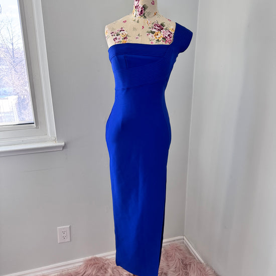 Turn heads in this captivating cobalt blue, one-shoulder bodycon gown—an absolute showstopper designed to sculpt and flatter your silhouette. Featuring an elegantly pleated asymmetrical neckline and a sleek, figure-hugging fit, this dress exudes sophistication and modern allure.