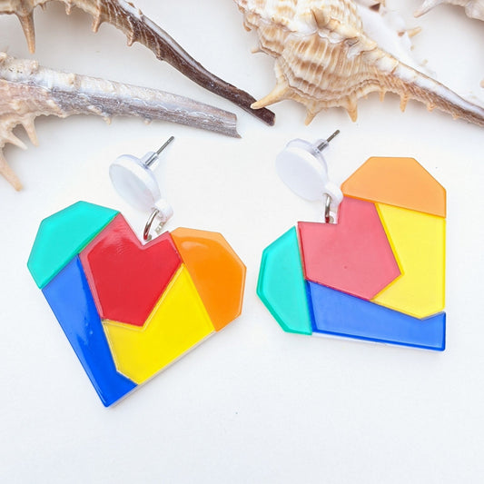 These rainbow, vibrant mosaic earrings are lightweight statement pieces that are perfect for any occasion. Whether you're attending a festival, enjoying a beach day, or simply adding everyday flair, they'll add a playful pop of color to your look.