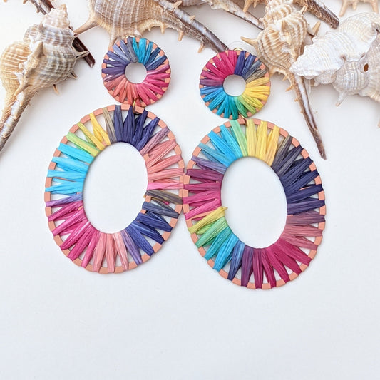 Add a vibrant pop of color to your look with these rainbow raffia hoop earrings – lightweight and bold 🌈✨ Shop now for a unique statement piece!
