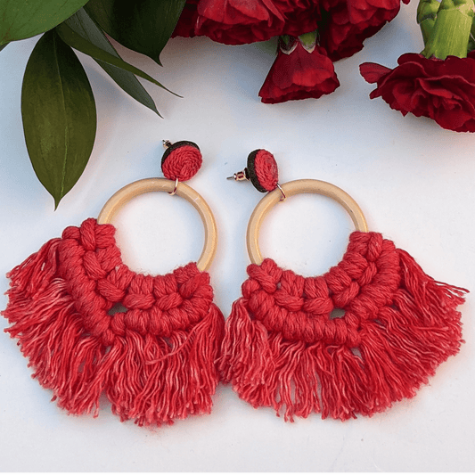 Boho-chic red macramé hoop earrings with wooden accents—perfect for a bold, statement look.